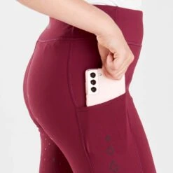 Harry Hall Junior Winter Riding Tights Burgundy 5 Harry Hall Junior Winter Riding Tights Burgundy -Saddle Store burgundy winter tights phone pocket detail image